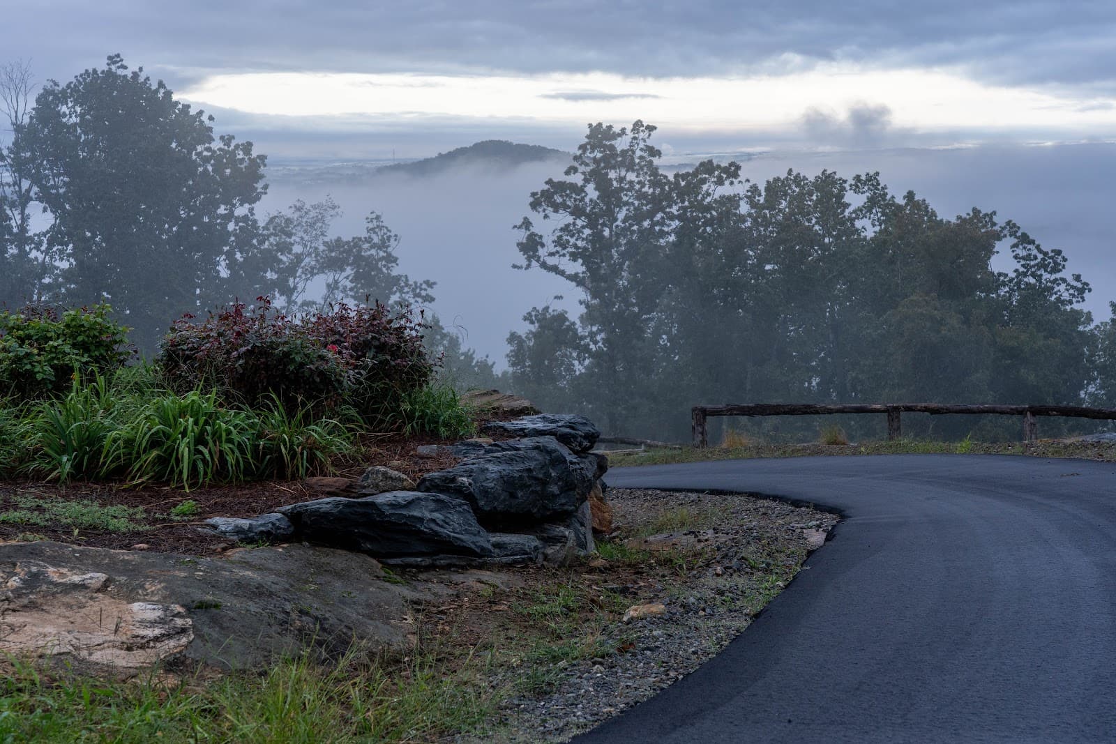Misty mountain road with stone landscaping at Longview Carolina
