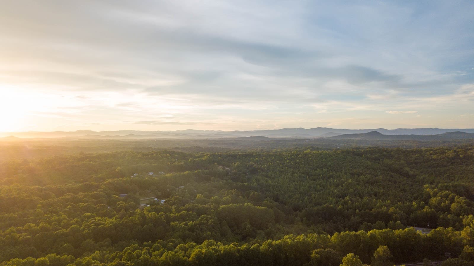 Golden hour mist filling the mountain valley at Longview Carolina