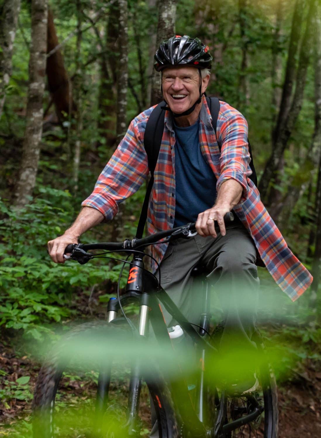 A cyclist on a wooded trail at Longview Carolina